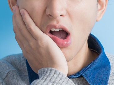 boy with tooth pain